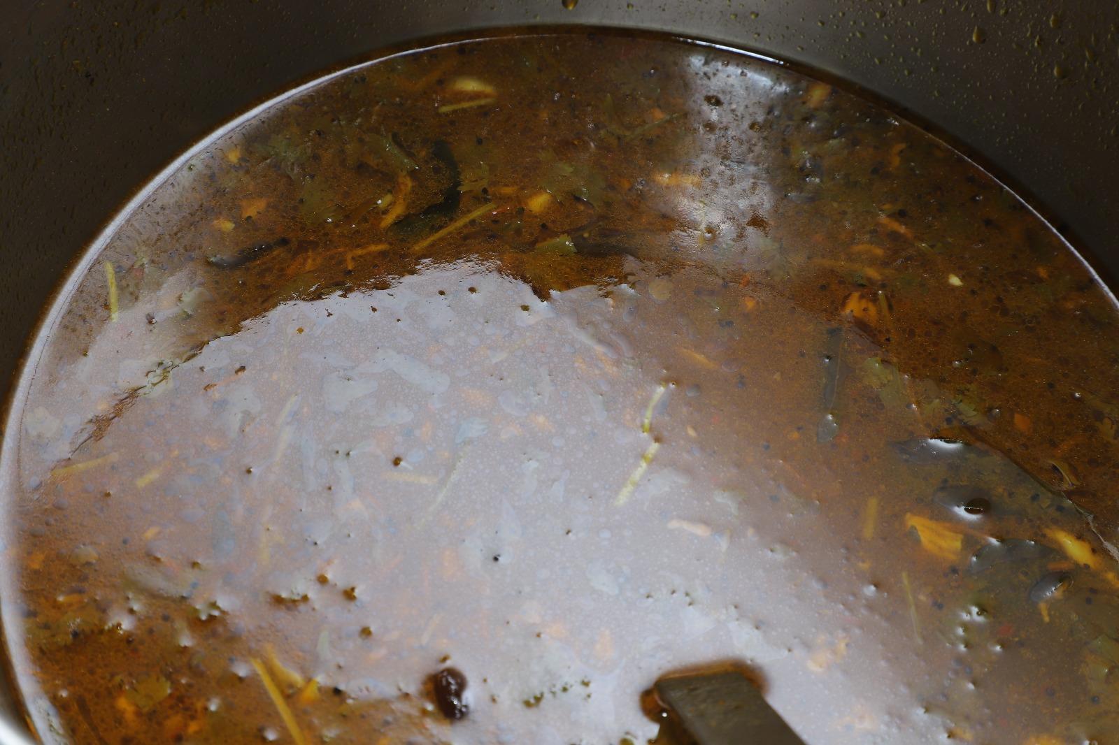 South Indian rasam prepared by MJ Catering